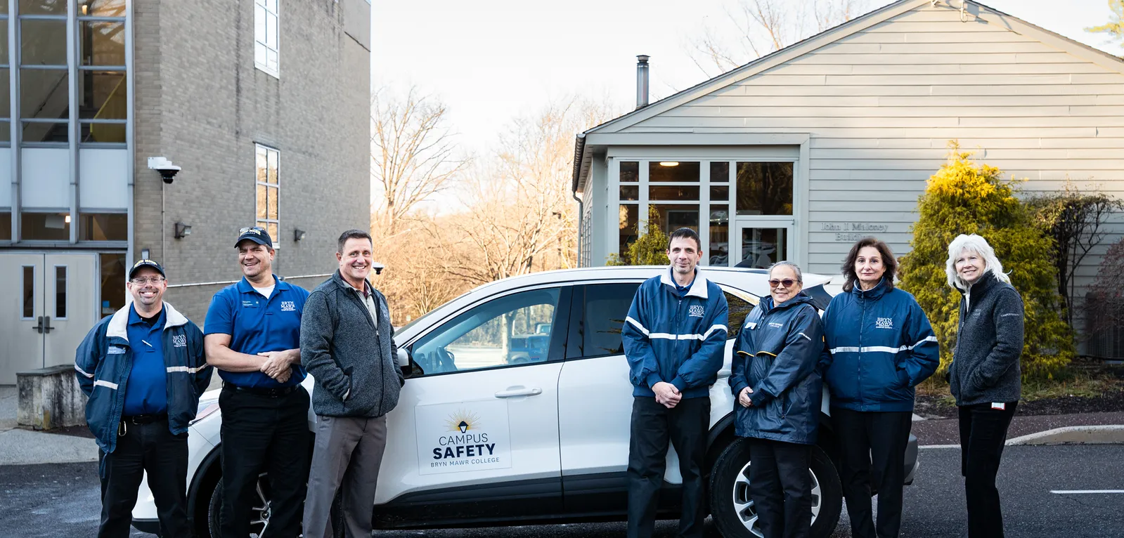 campus safety staff with a vehicle