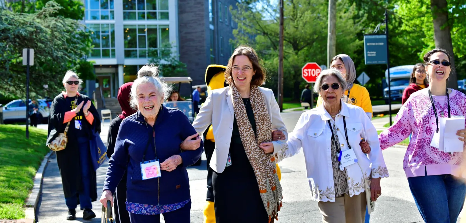 Two Golden Sage alums walk with President Cadge and other alums at Reunion 2026.