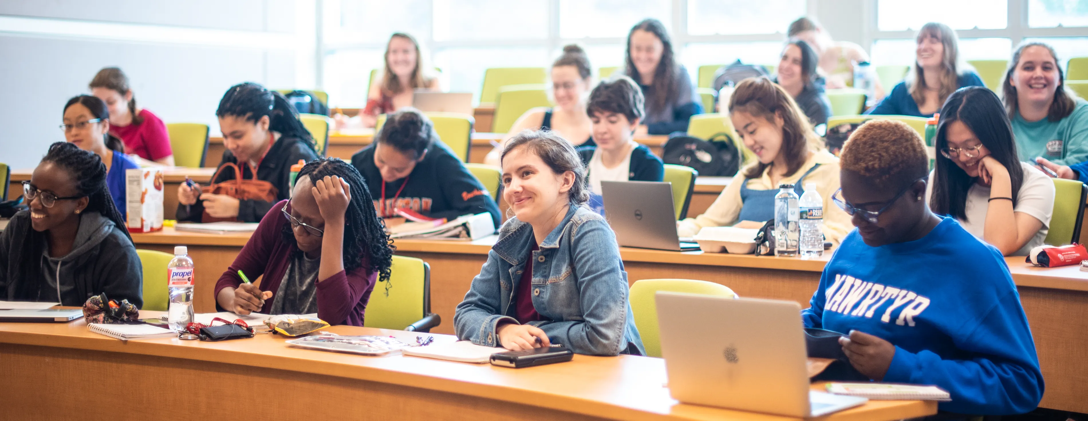 students in classroom taking notes