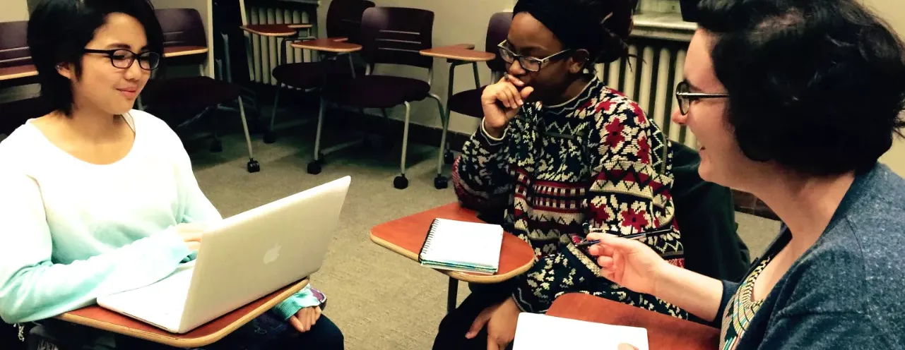 Faculty and students in conversation.