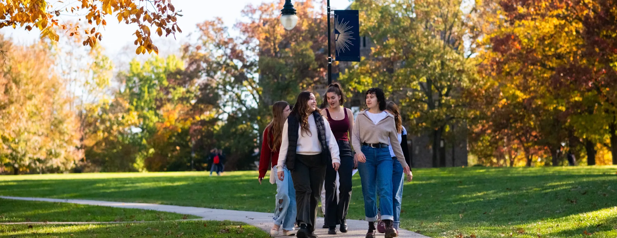 students-walking-campus-fall-free-tuition-bryn-mawr