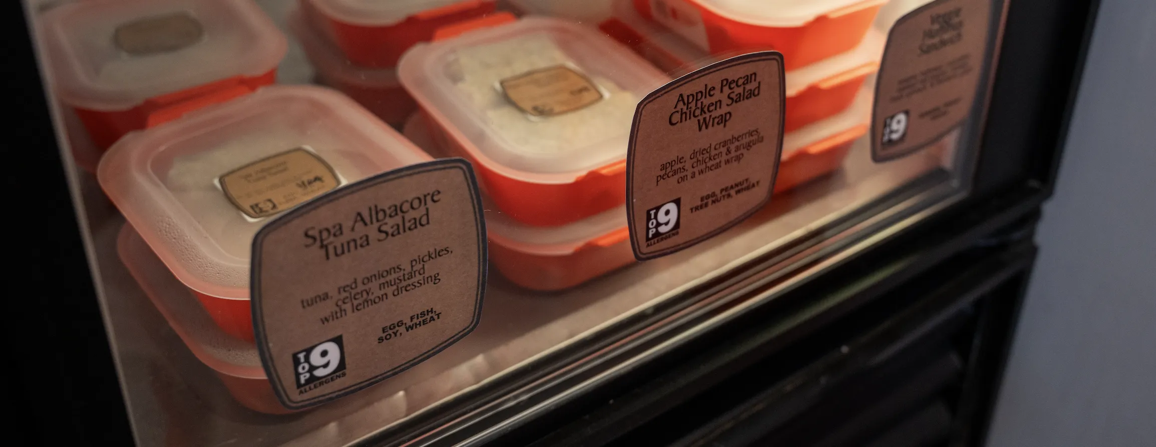 Fridge full of orange takeout containers