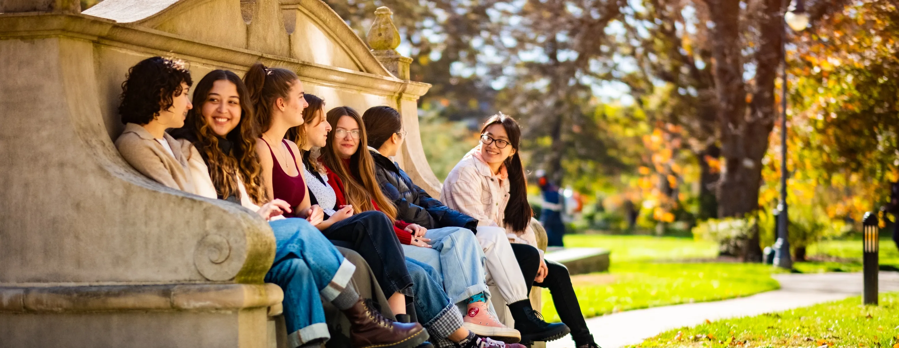 students sitting on moon bench