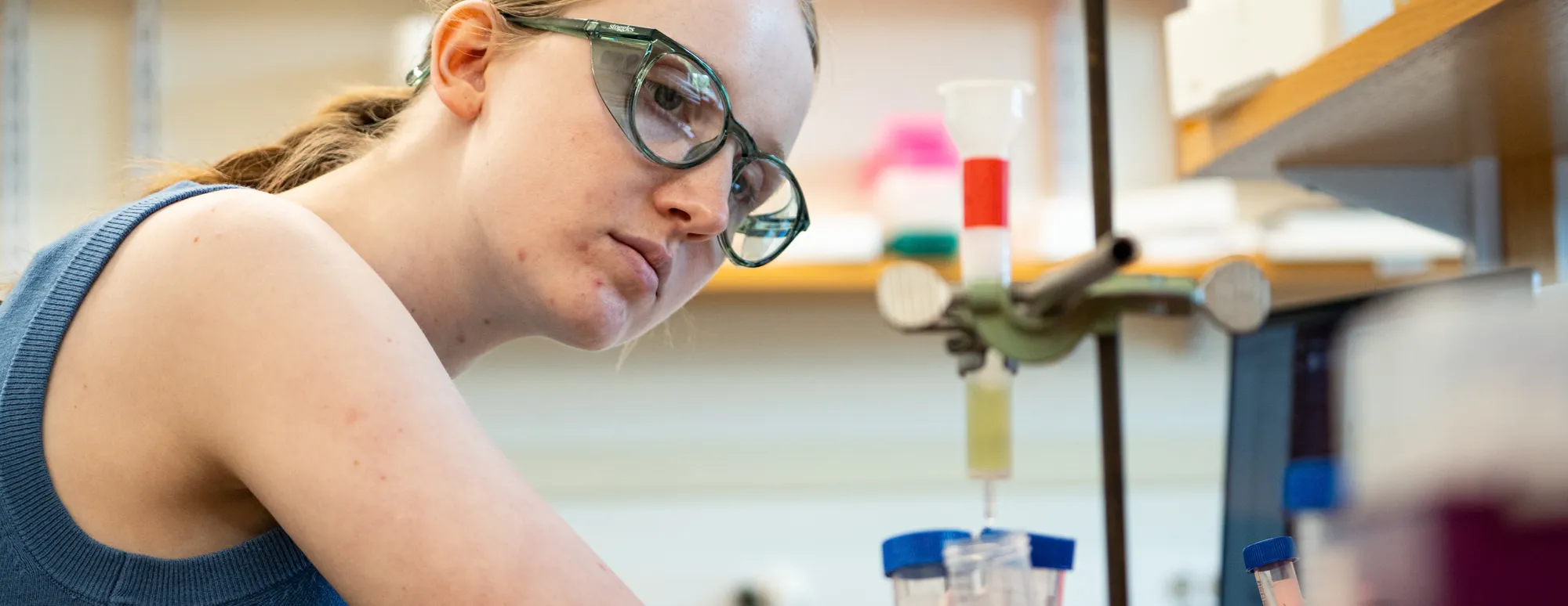 A Bryn Mawr College student working on research in a lab