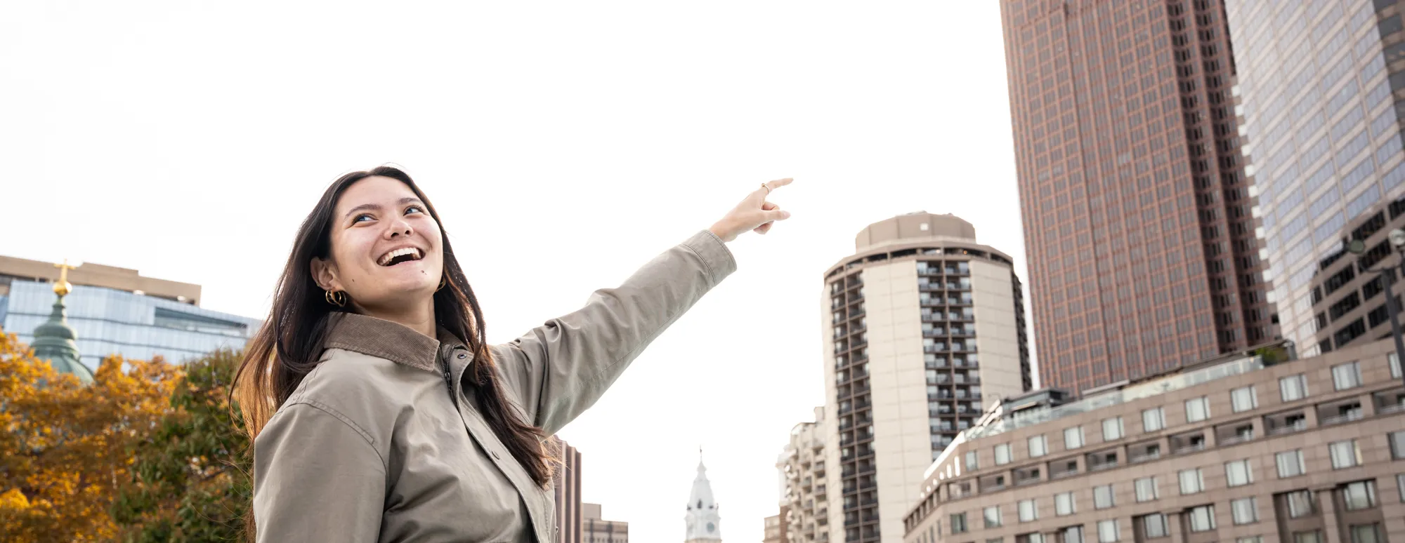 A Bryn Mawr student looking upward and forward to the future with her undergraduate degree.