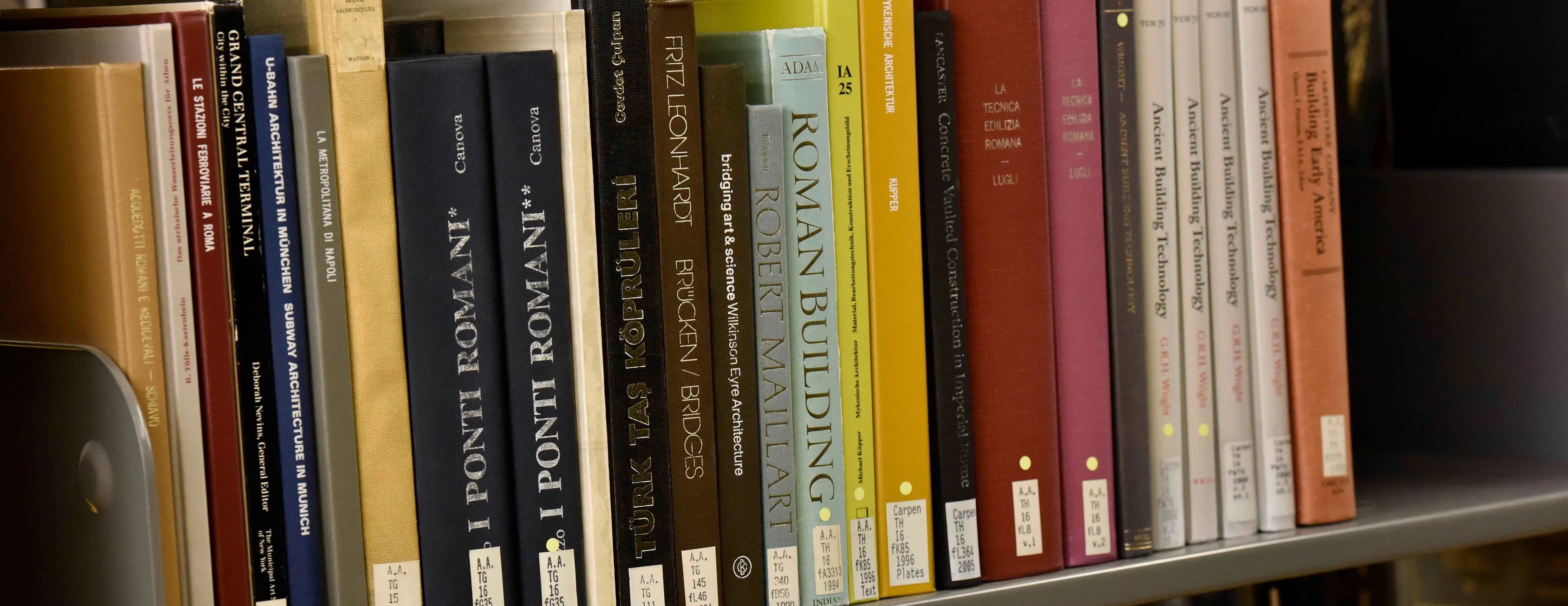Faculty books and publications on the library shelf