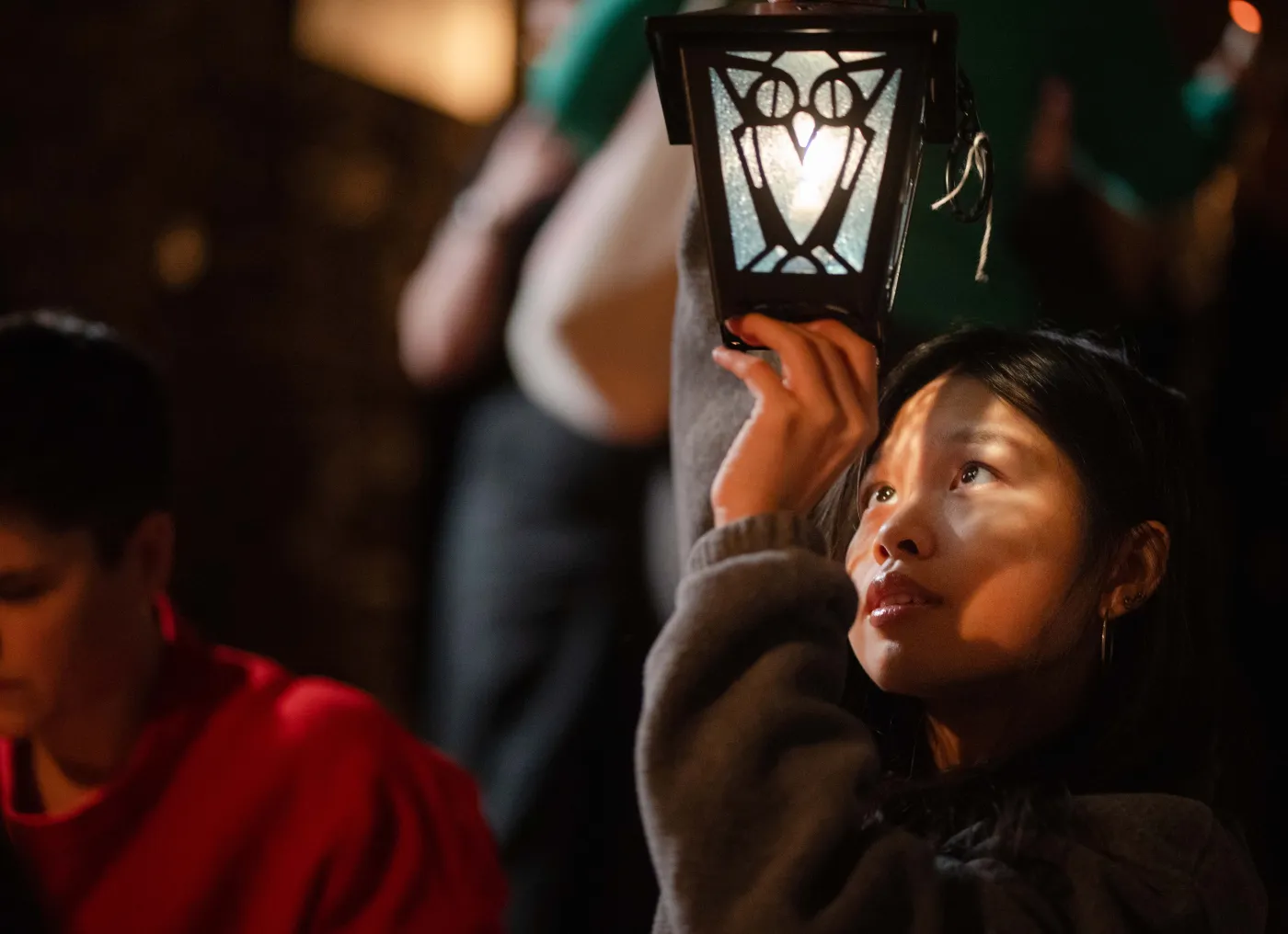 student looking up at her Lantern
