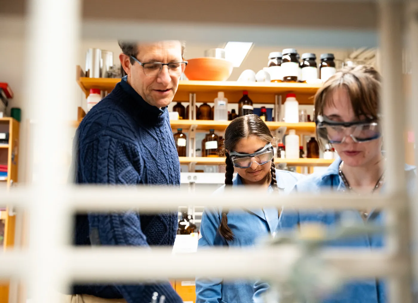 students and a professor in the lab
