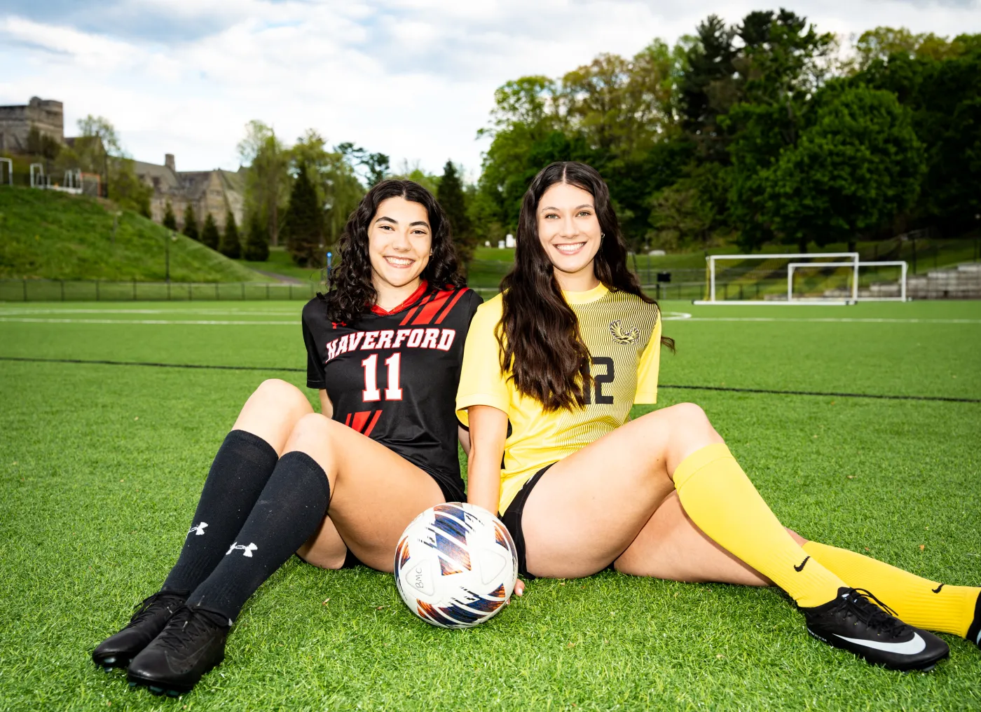 Twin sisters with a soccer ball