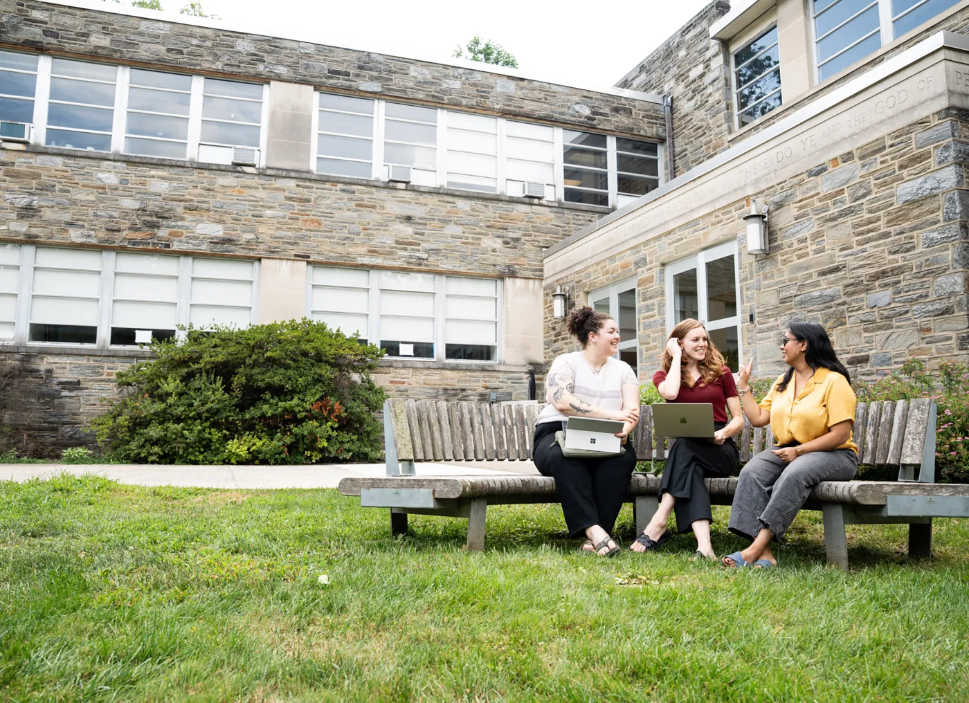 Master of Social Work hero image of MSW students sitting on a bench