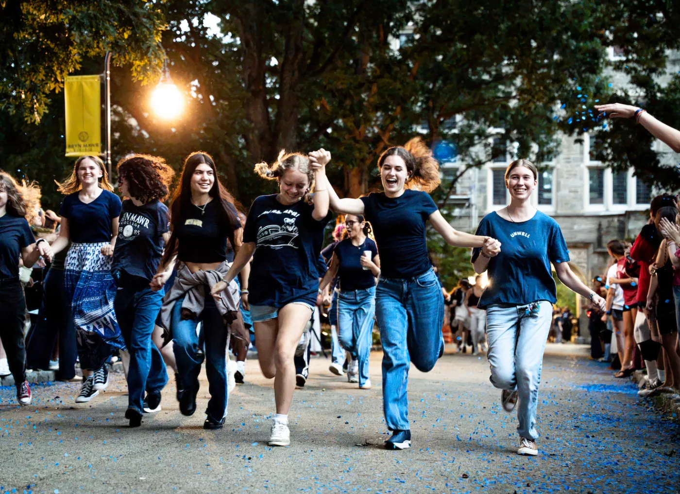 student running down Taylor Drive on parade night