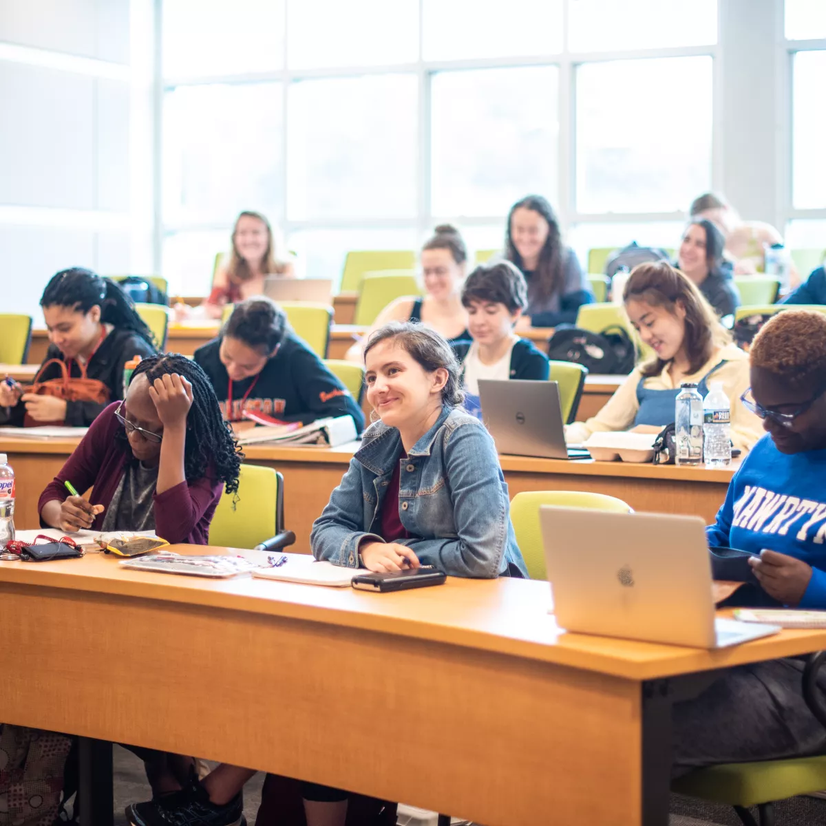 students in classroom taking notes