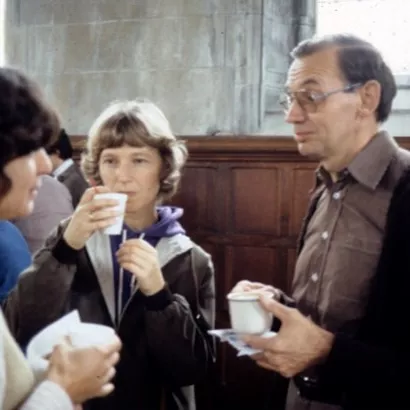 Faculty member and students drinking coffee