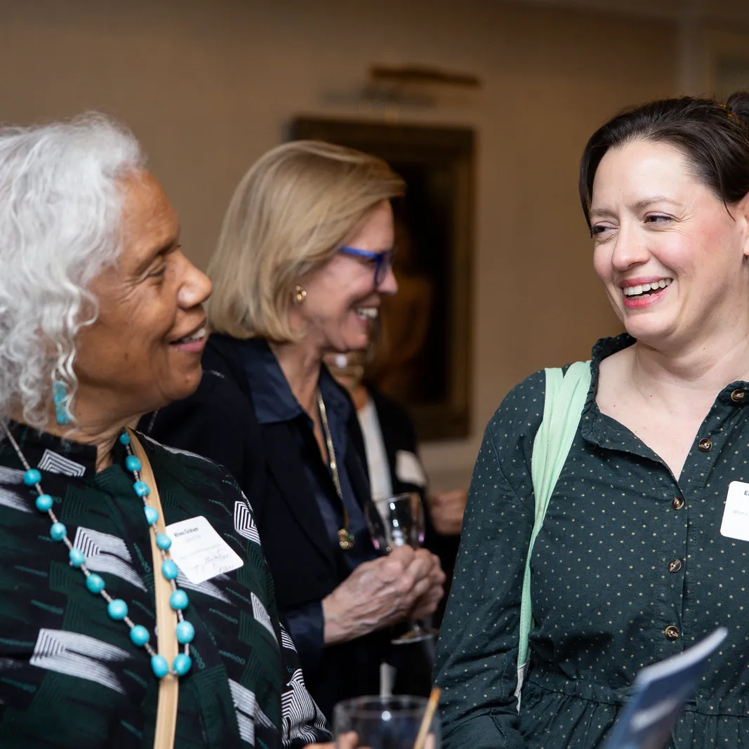 two women speaking at a conference