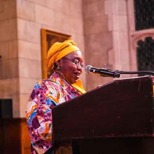 Dr. Fanta Aw speaking over a podium