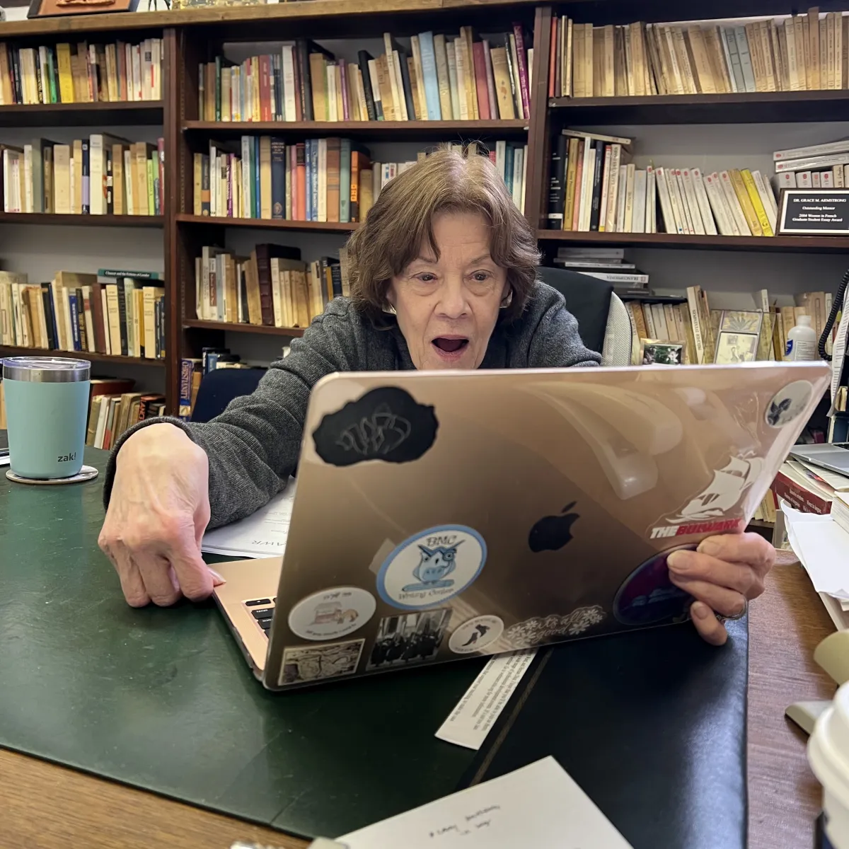 Professor looking surprised at a computer screen