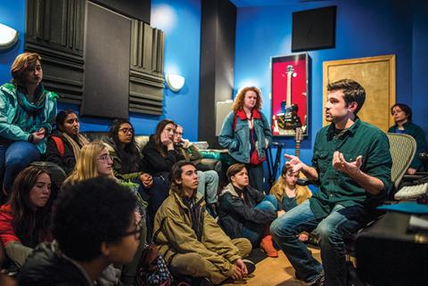 Because the field of audio production has been male-dominated for so long, Weidman wanted to demystify a space where women haven’t been at the controls by organizing a field trip to a local recording studio. Professor Teaching