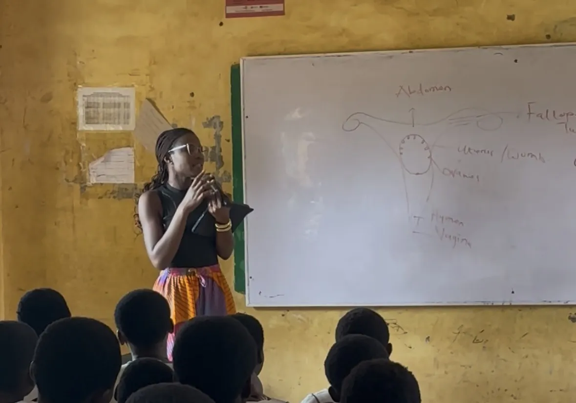 Theresah speaking to a room of students