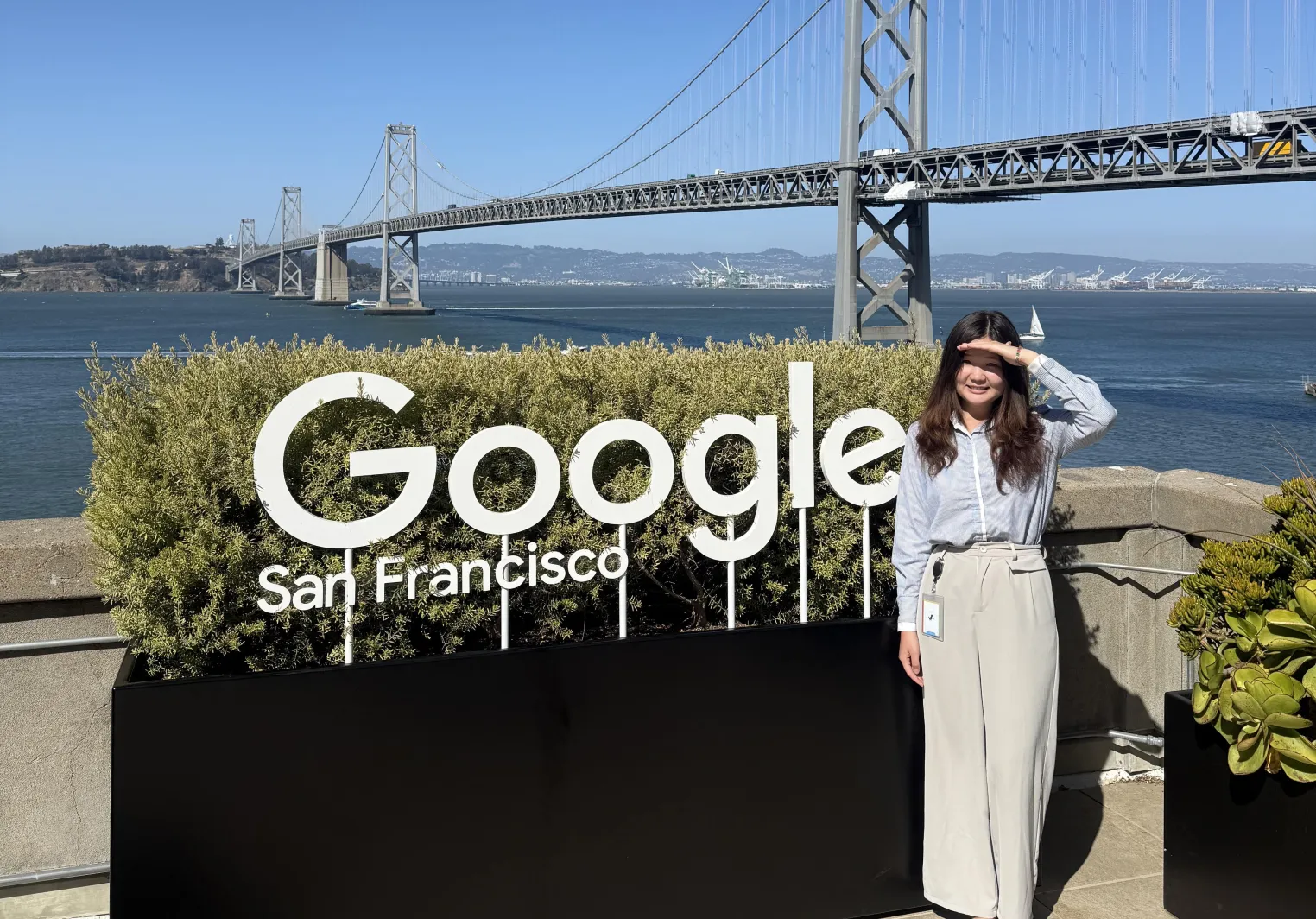 Saniya standing next to a Google sign in San Francisco