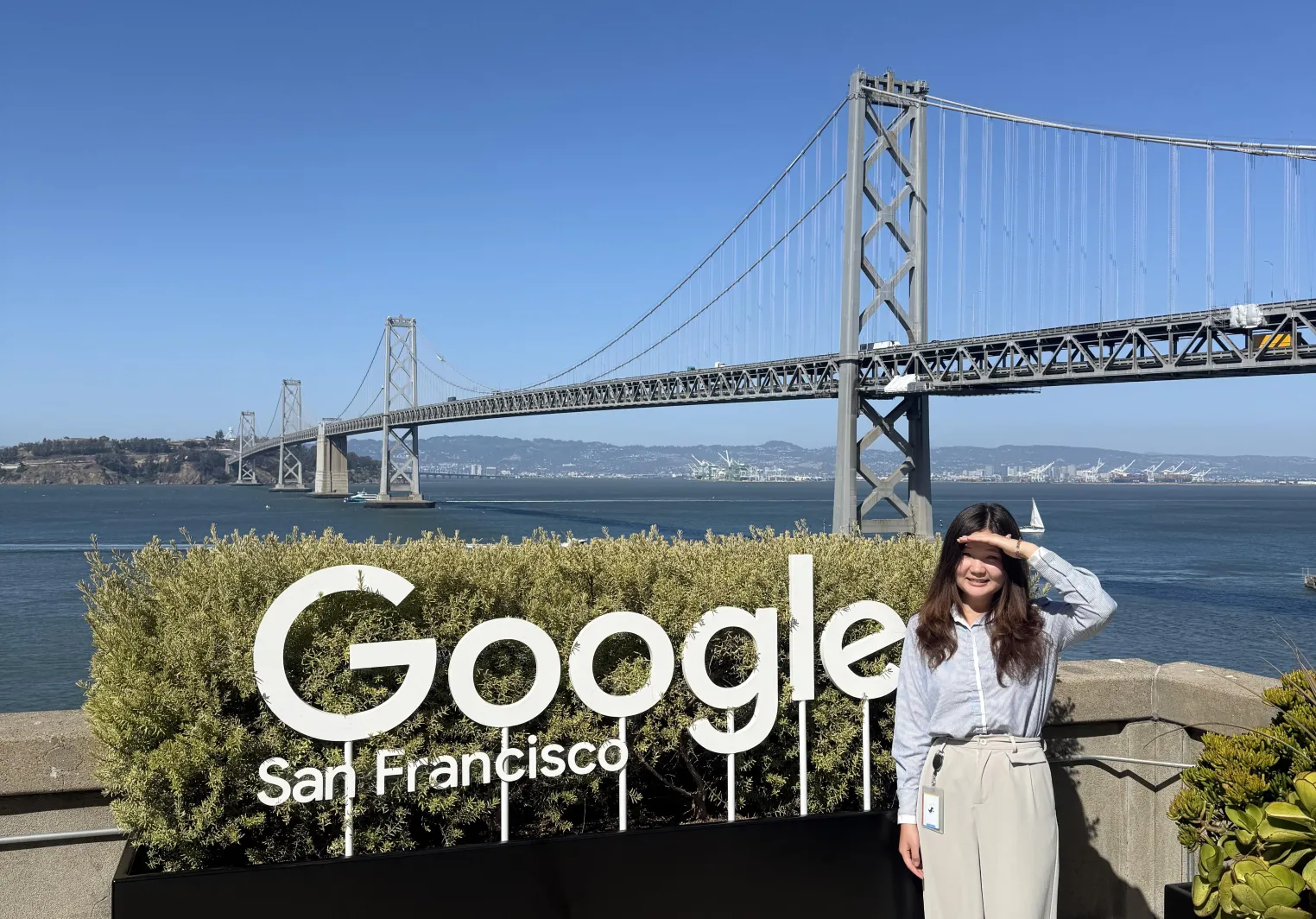 Saniya standing next to a Google sign in San Francisco
