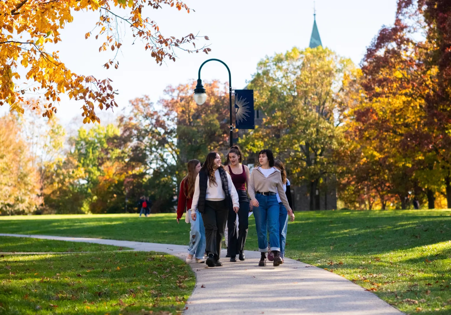 students-walking-campus-fall-free-tuition-bryn-mawr