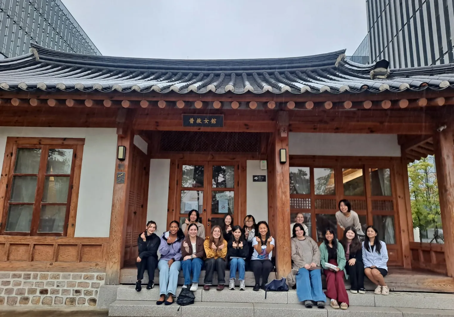 A group of students posing for a group photo in Korea