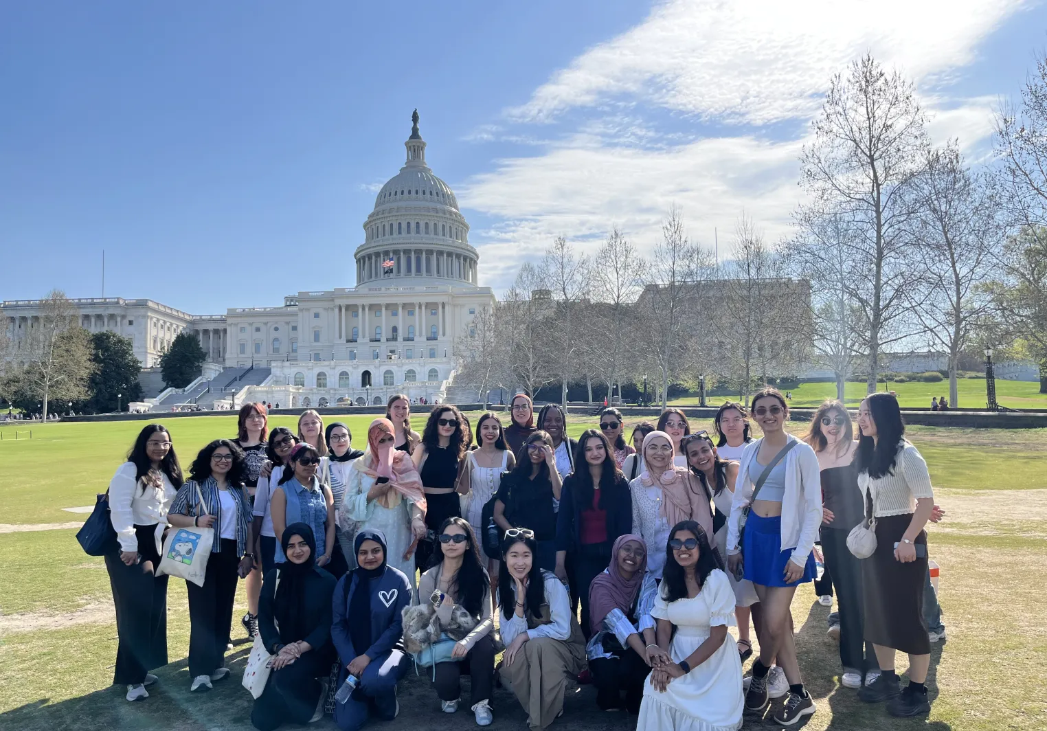 International students pose in front of Captiol Building