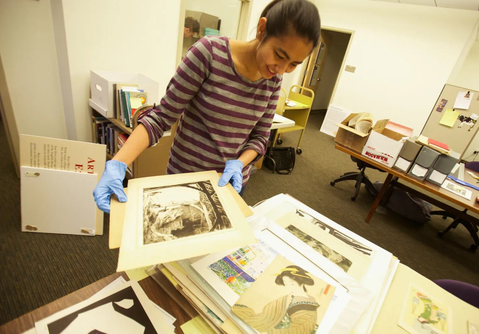 A student of history of art works with special collections prints