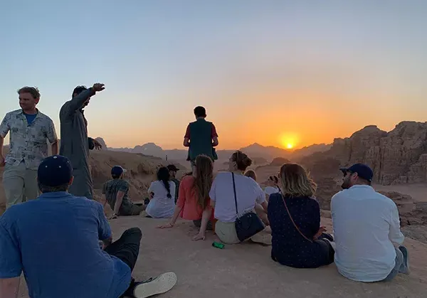 Arabic Studies Student photographs a sunset in a wadi while studying abroad