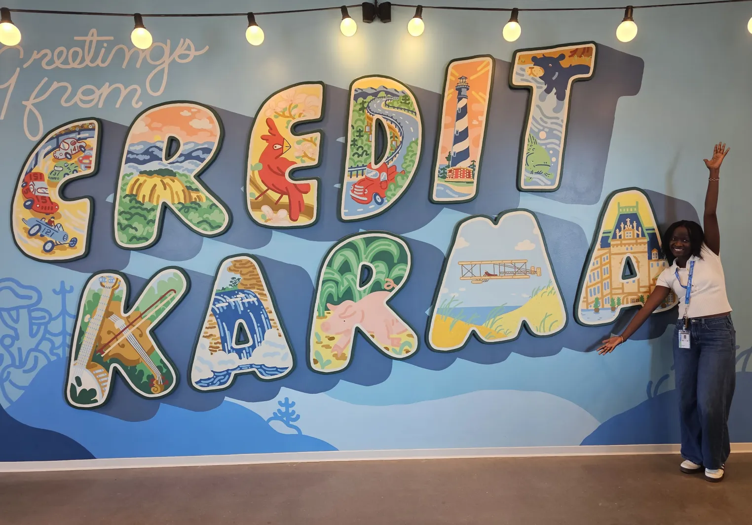 Keziah in front of a Credit Karma Mural