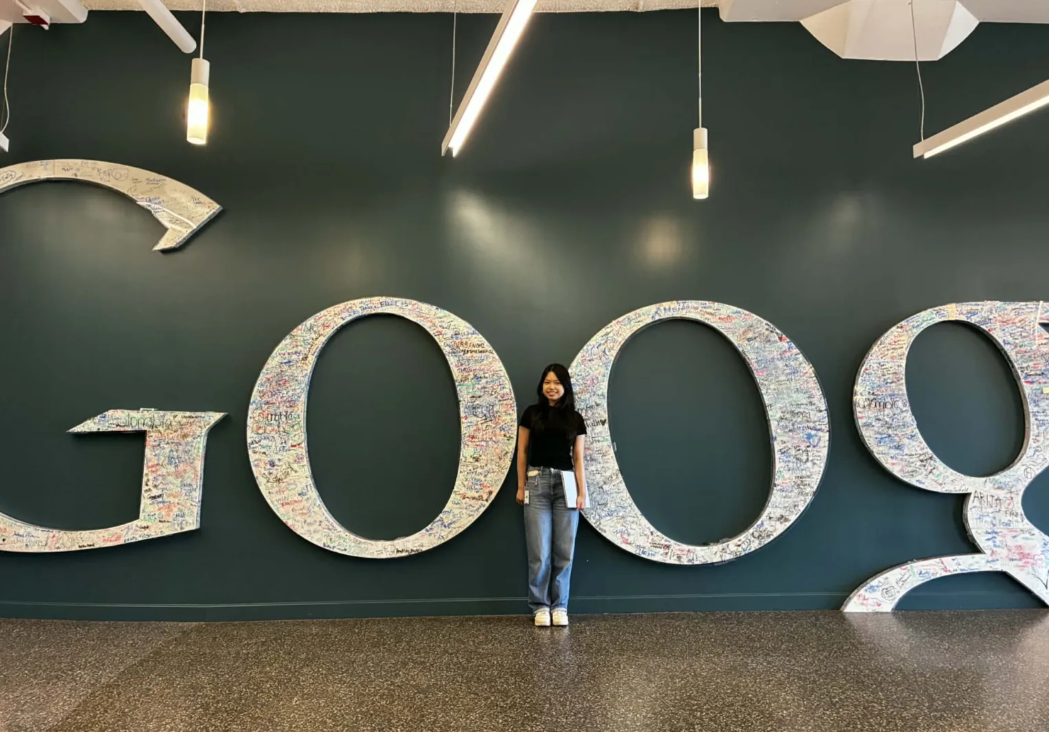 Khanh Ha in front of the Google logo