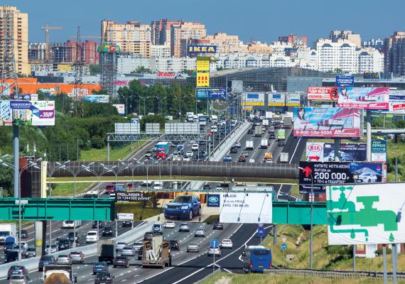 Image of a busy road in Russia with billboards on all sides