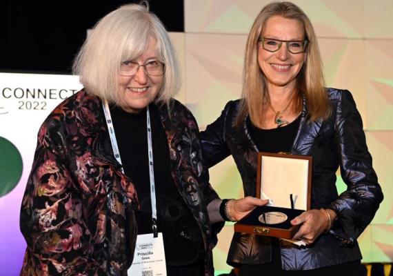 GSA President Barbara Dutrow awards the GSA President’s Medal to Priscilla Grew '62. Photo credit: Geological Society of America, photo by Bill Cronin.