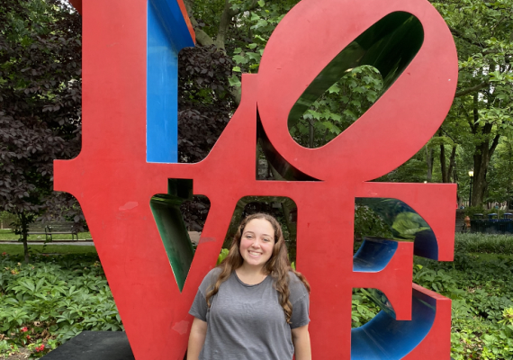 Elizabeth in front of the LOVE sign