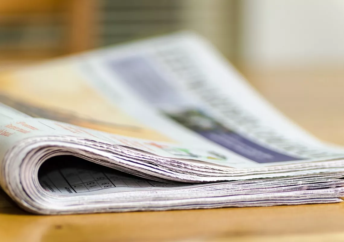 Newspaper on table