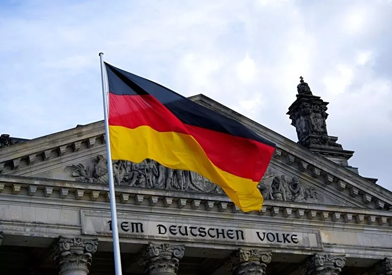 German flag in front of Dem Deutschen Volke