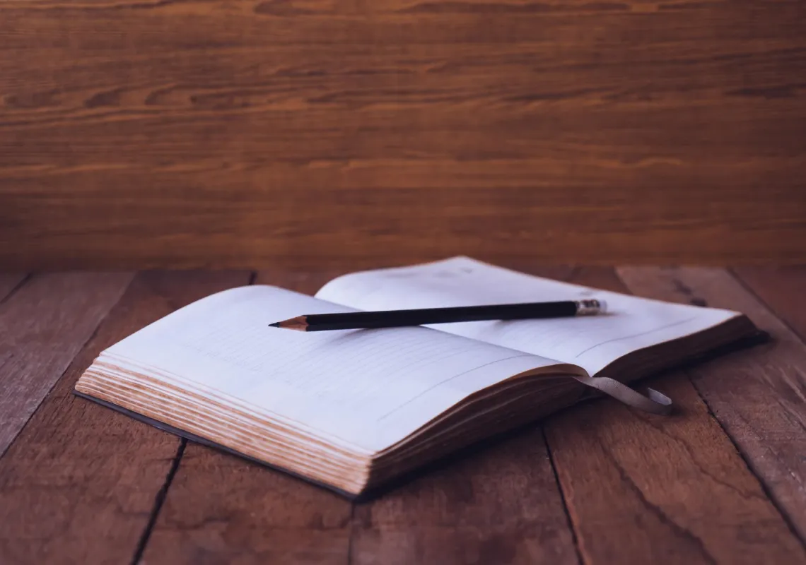 Book and pen stock
