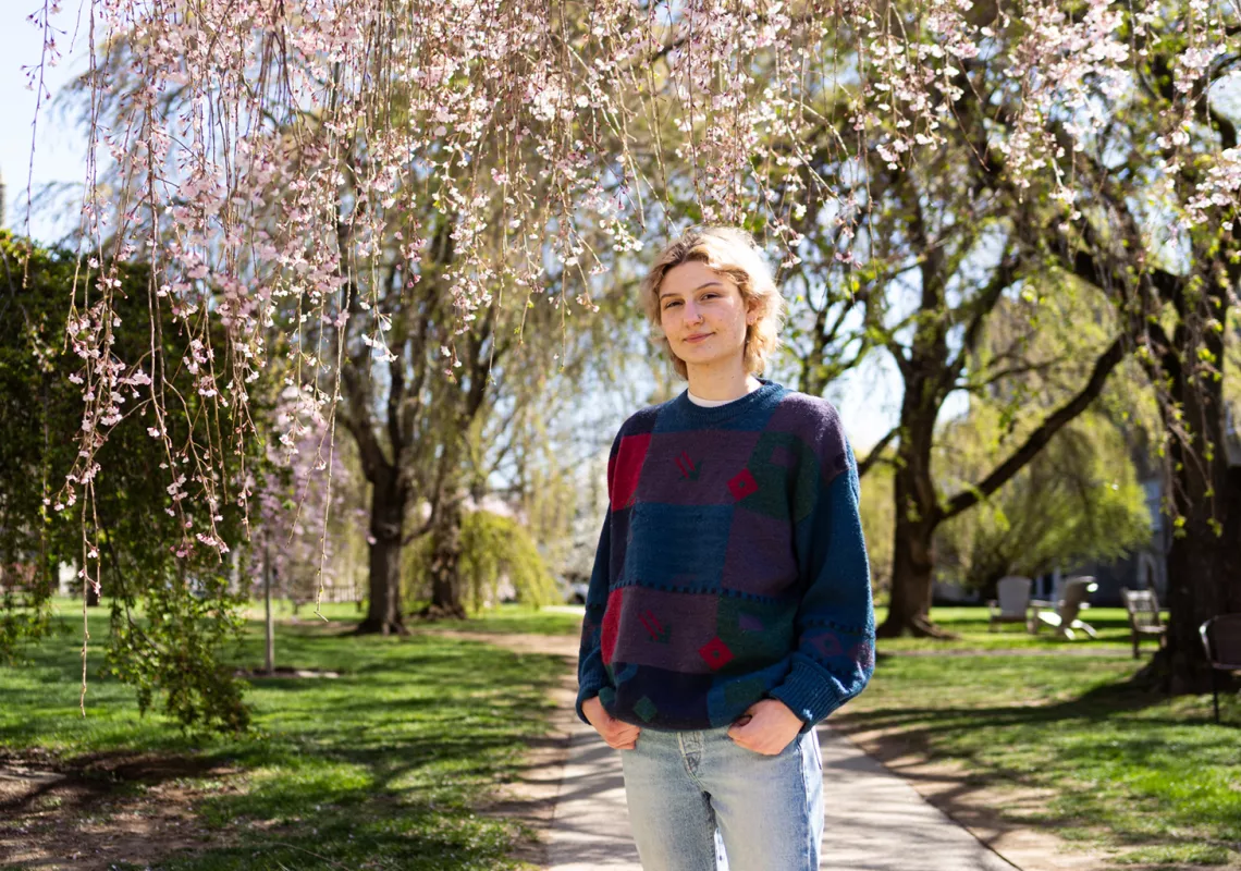 Charli Parsons '25 under the cherry blossom trees, stem research alumni