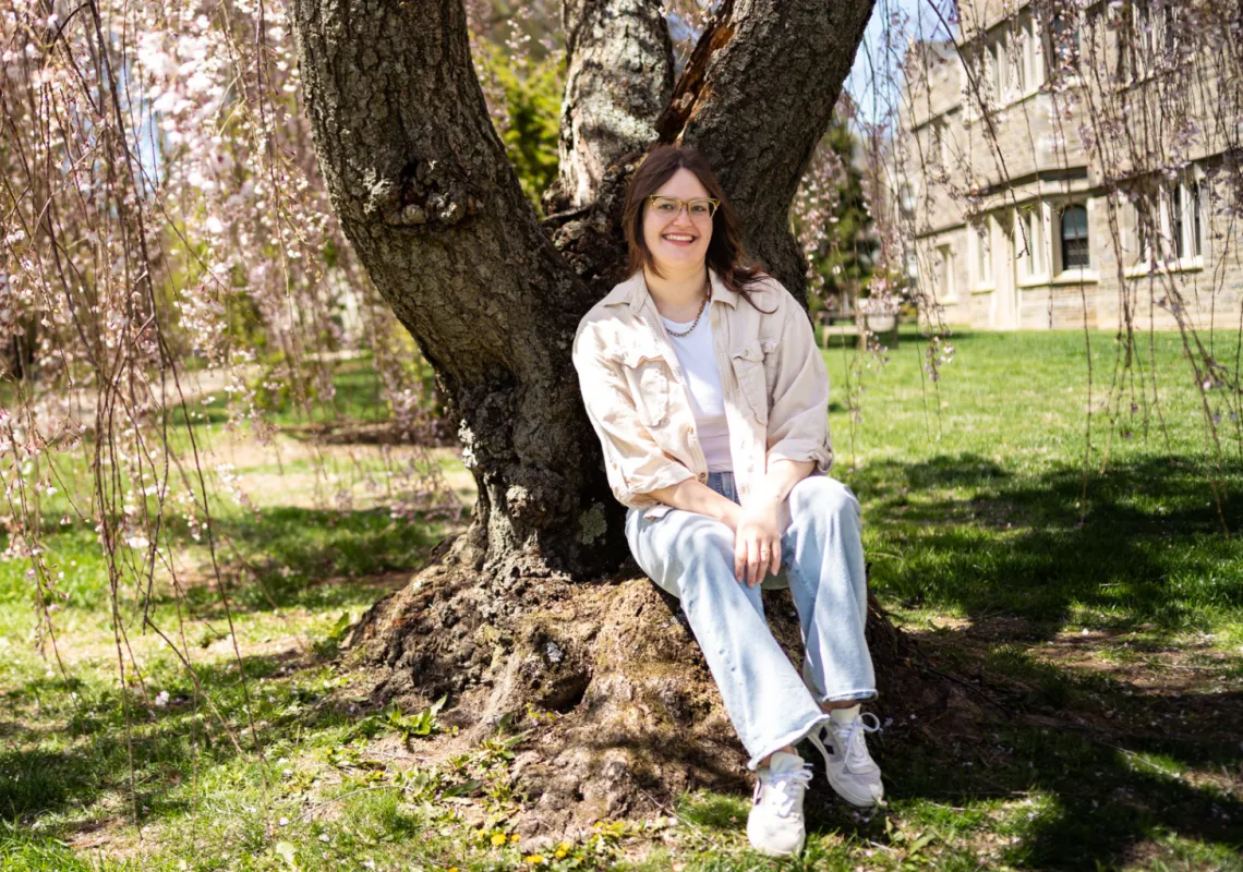 Brooke sitting under the cherry blossoms