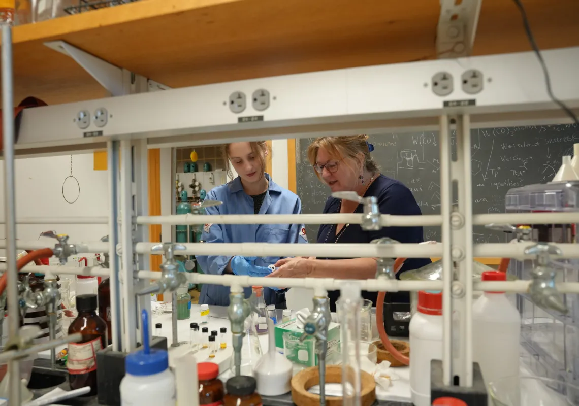 student and faculty in lab