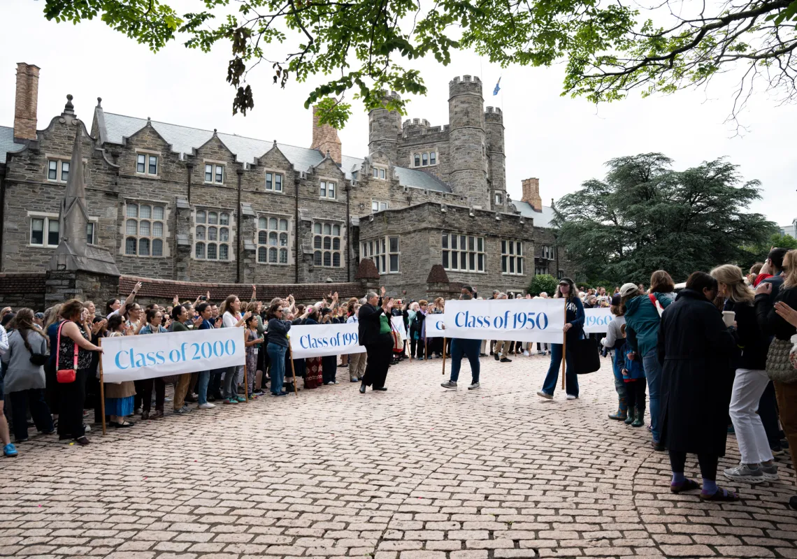 The classes proceed behind their banners into Goodhart during Parade.