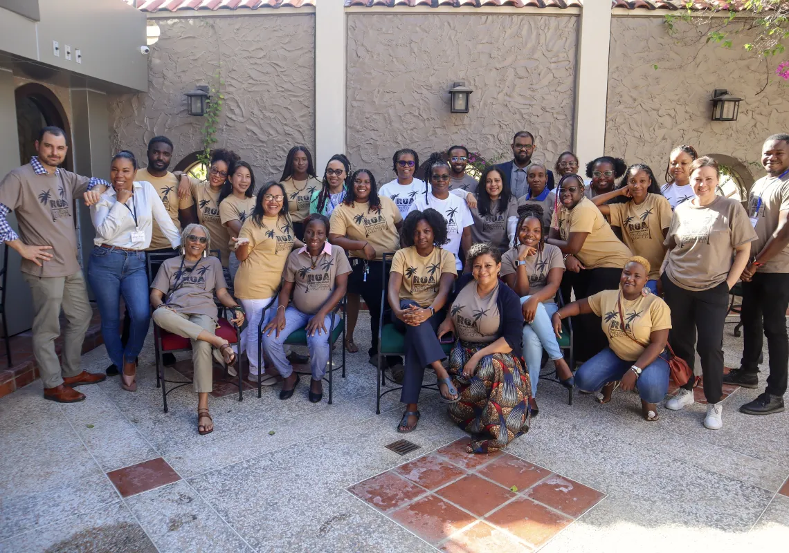 Moss standing with participants in the RGA Program