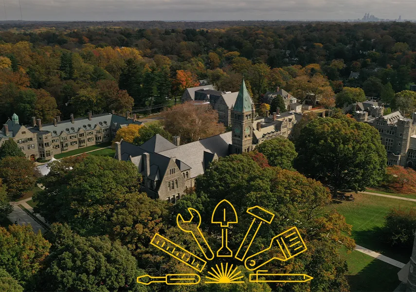 Drone photo of campus with Taylor hall at the center with Building the Next Chapter logo