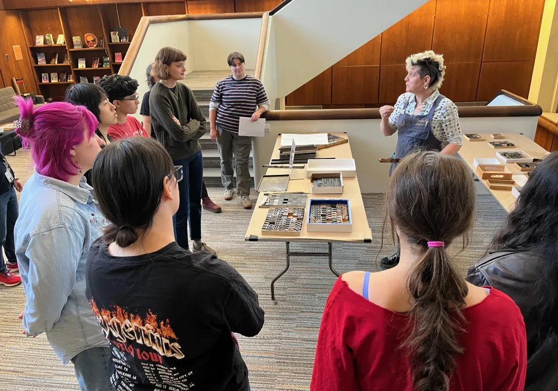 PRINTADELPHIA's Marsha Simmons instructs students on how to prepare press printing designs during a workshops