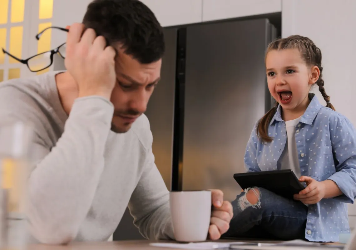 Overwhelmed father with daughter