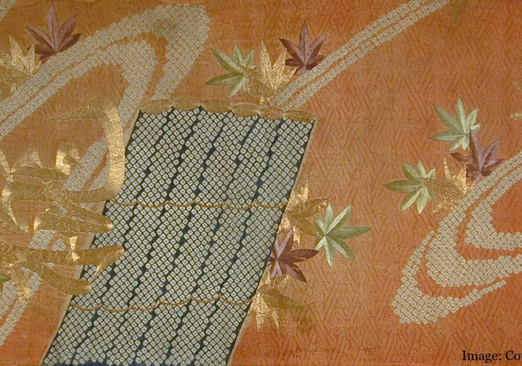 Orange fabric with embroidered embellishments