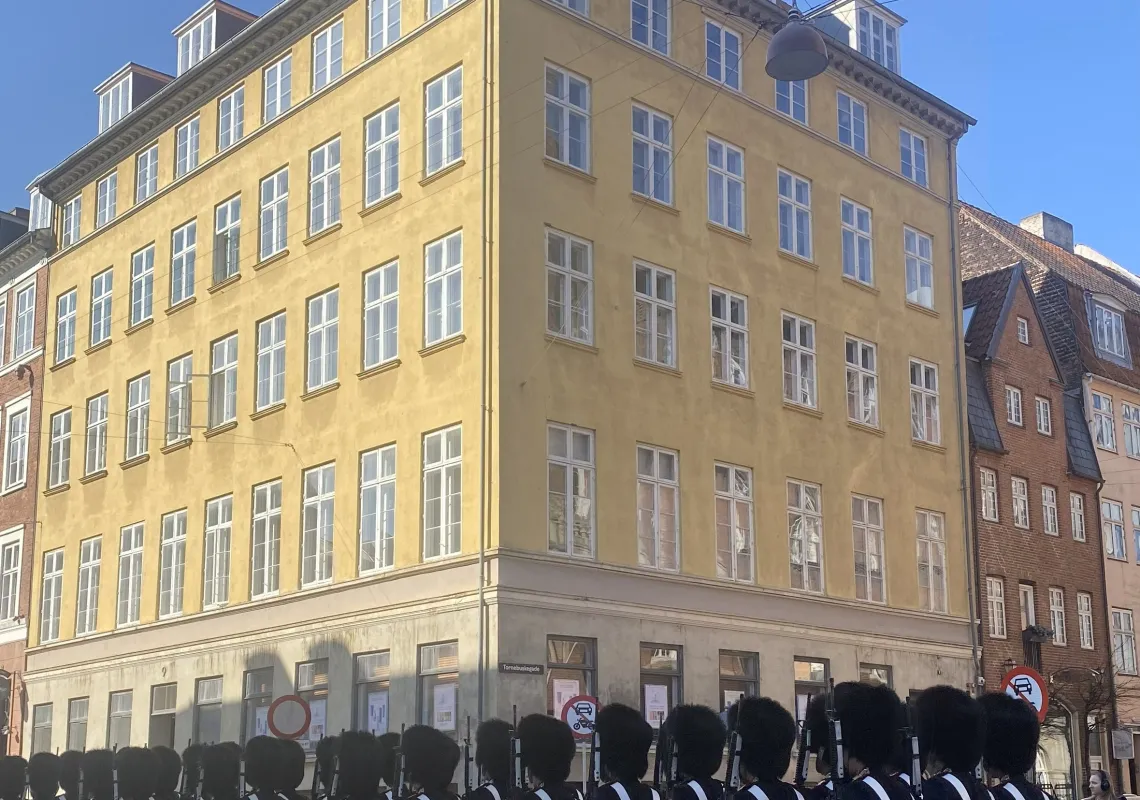 a parade of royal guards on a street in Copenhagen