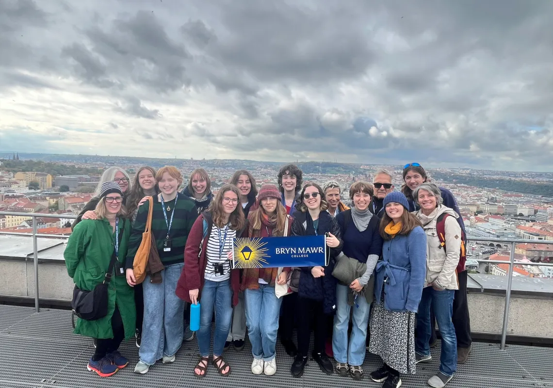 A group of faculty and staff posing for a photo in Prague