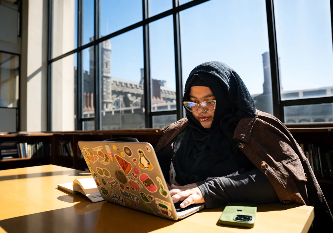 Student on computer in the library