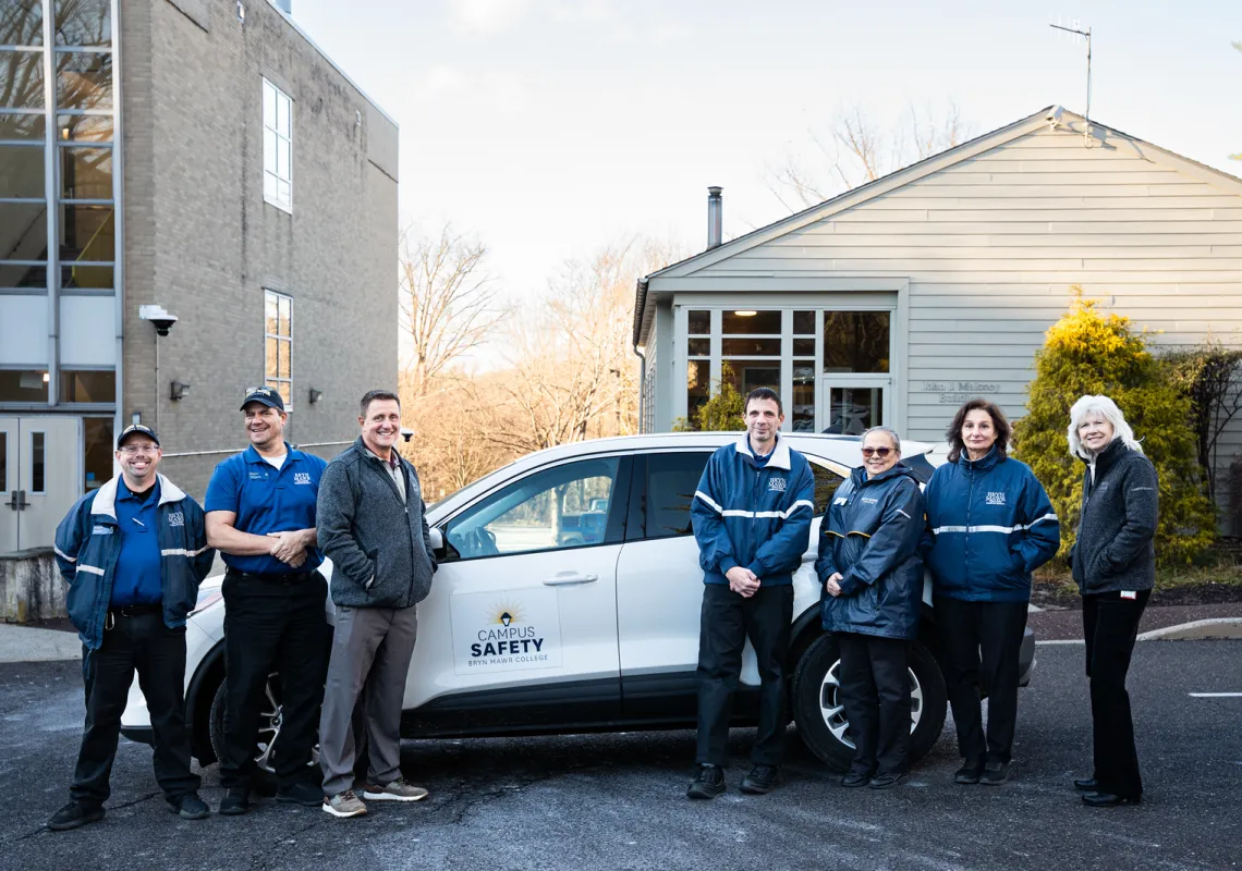 campus safety staff with a vehicle